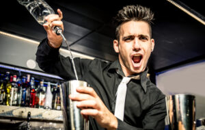 A Bartender is excited to serve liquor to their customers after permitted hours.